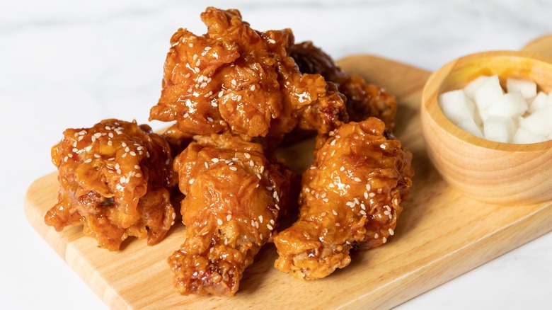 pieces of korean fried chicken with pickled radish