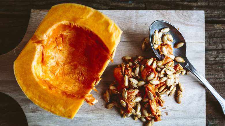 scooping out pumpkin seeds