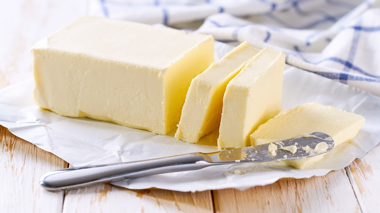 sliced butter on a white plate