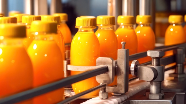 Manufacturing plant orange juice bottles