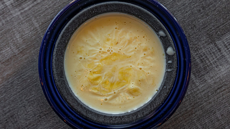 queso with a thin film on top