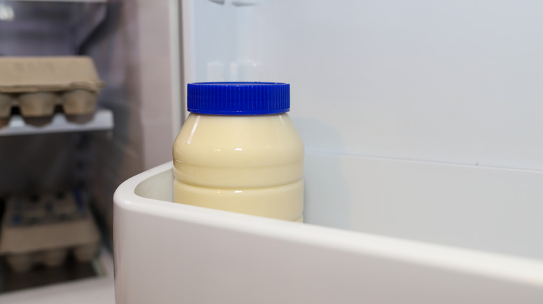 Jar of mayonnaise in refrigerator door