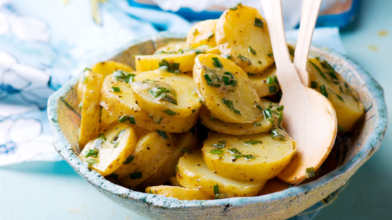 sliced boiled potatoes with herbs