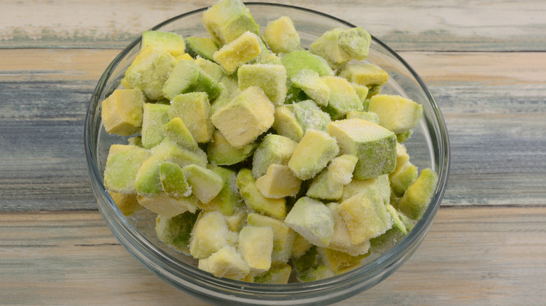 Frozen avocado cubes in a glass bowl