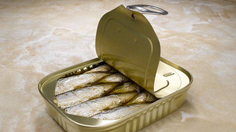 close-up of an open can of sardines