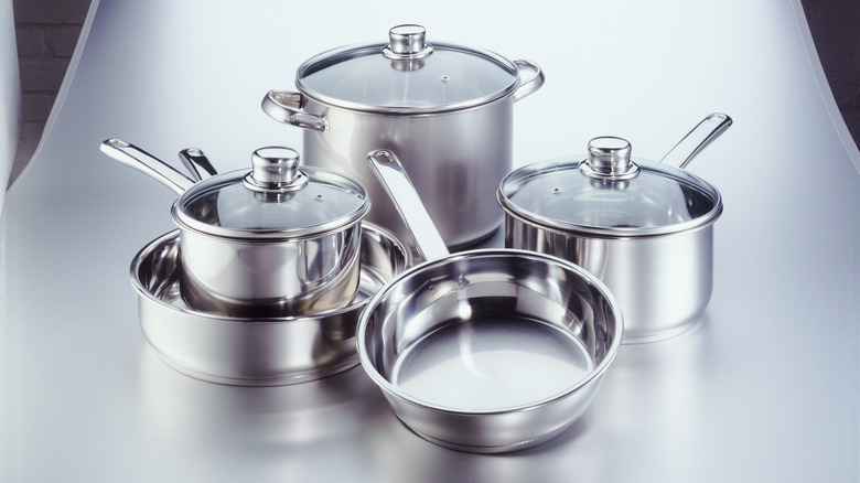 A collection of stainless steel pots and pans