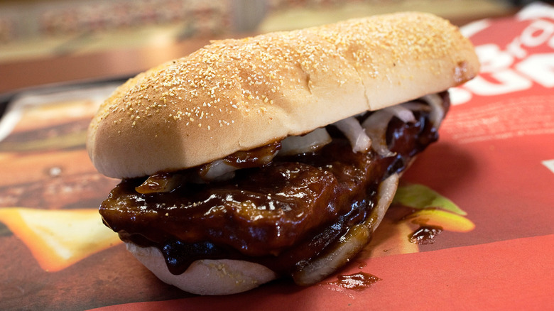 Close up shot of a McDonald's McRib sandwich on a tray