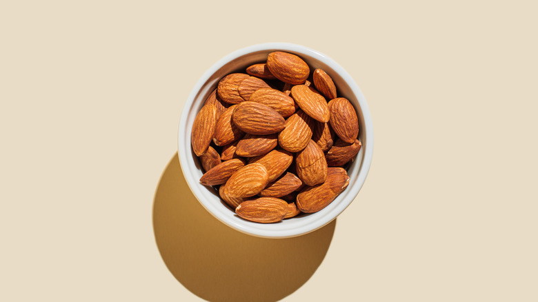 A ceramic bowl of almonds