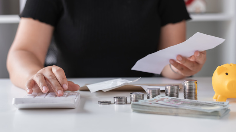 A woman calculating money