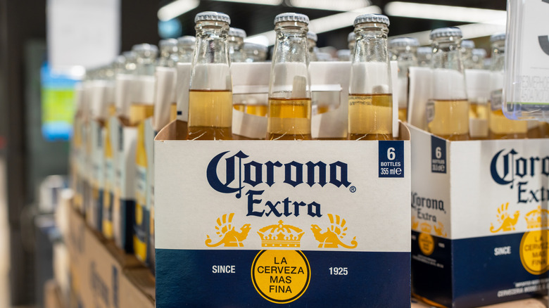 Six-packs of Corona beer on display in a store