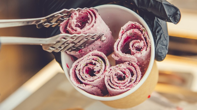 A rolled ice cream being served