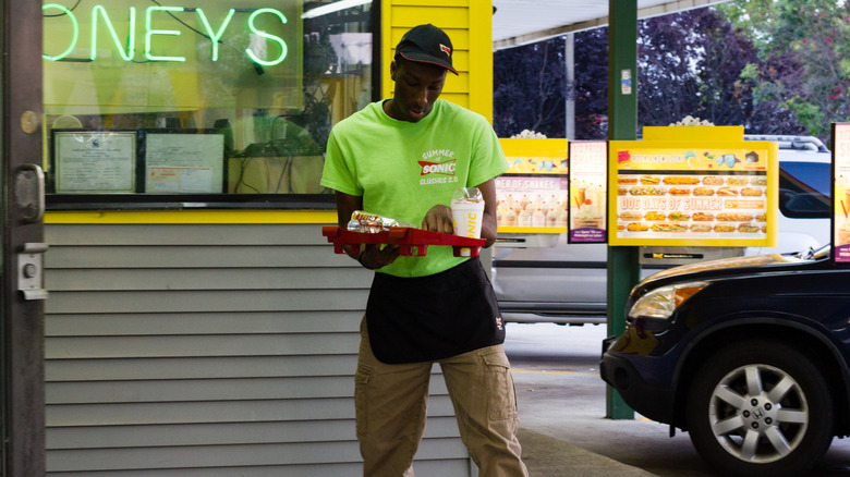 Sonic carhop on skates with tray of food