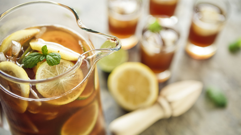 Pitcher of iced tea with sliced citrus