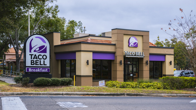 A Taco Bell restaurant with purple signage