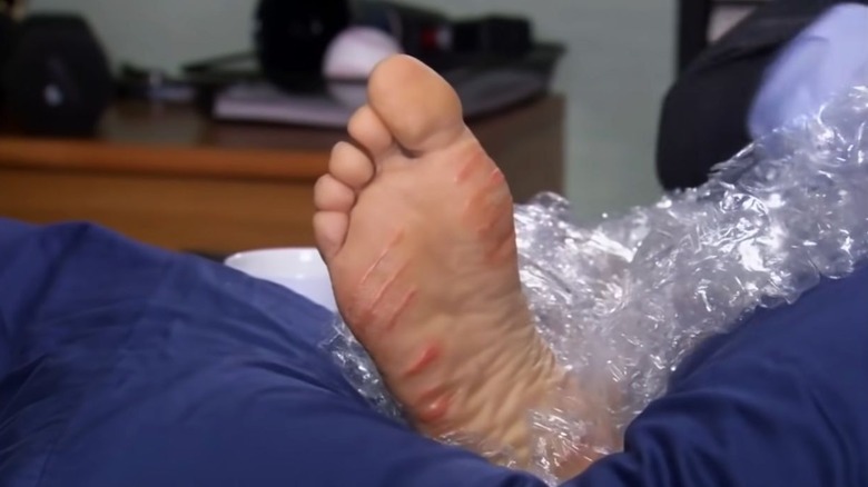 Close-up of Steve Carell's grilled foot from The Office