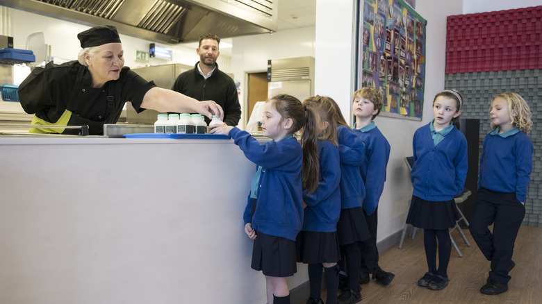 Children choose a milk in a school cafeteria