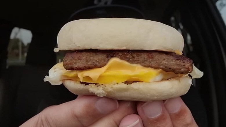 Wendy's breakfast muffin being held