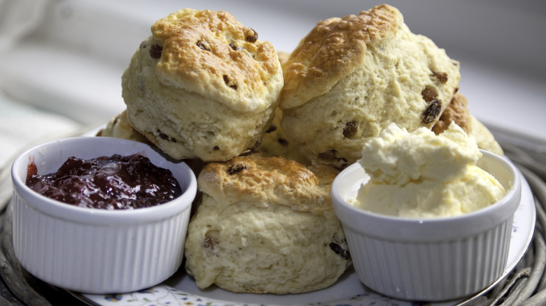 A pile of American-style biscuits in a wicket basket.