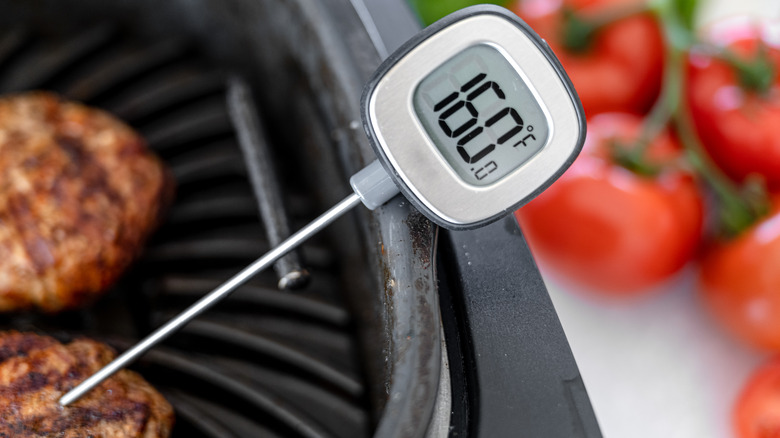 meat thermometer in a burger