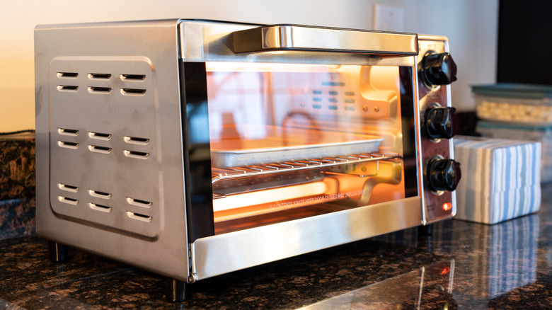 A hot toaster oven on a kitchen counter