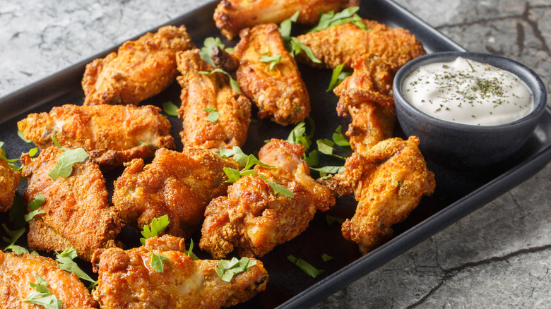 Baked chicken wings on sheet pan with creamy dipping sauce