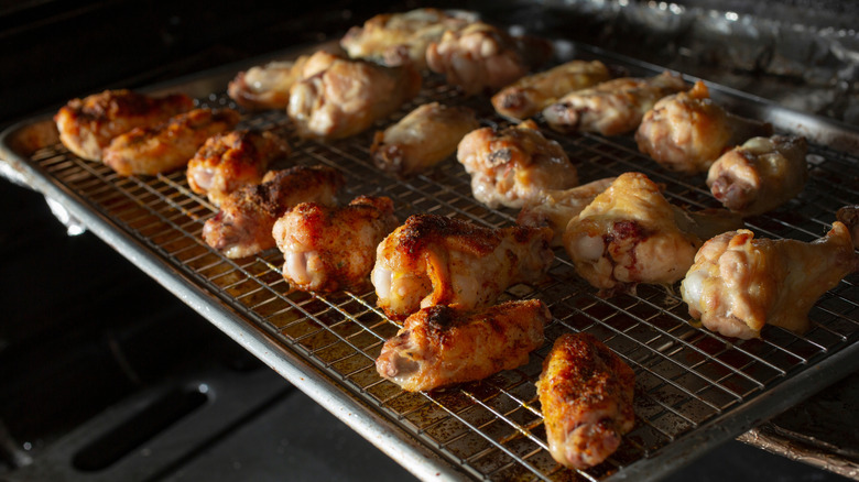 Baked chicken wings on a wire cooking rack