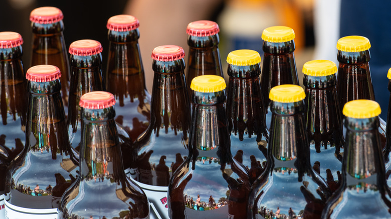 beer bottles with red and yellow caps