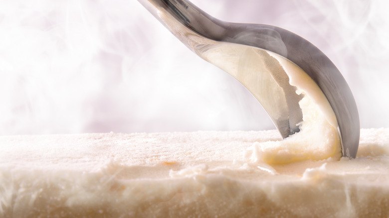 A close up of ice cream being scooped.