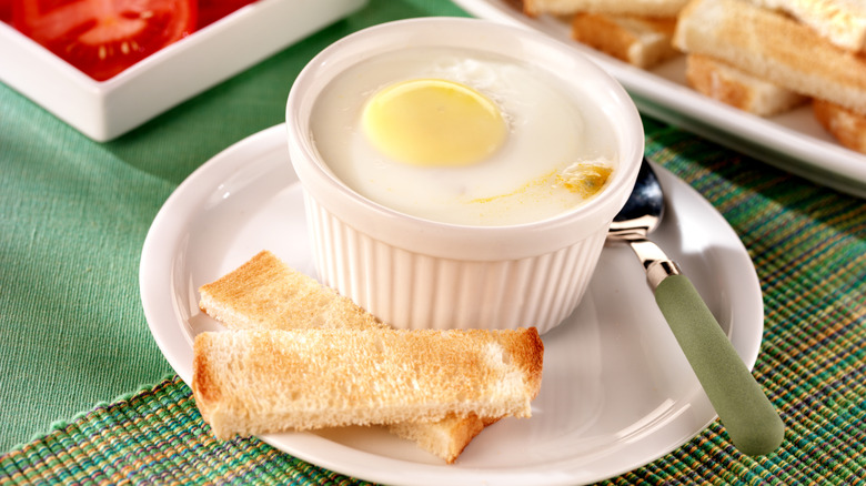 Ramekin with coddled egg and toast