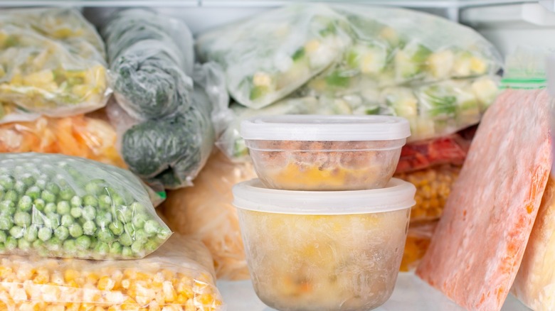 Frozen vegetables in clear sealed bags and clear containers