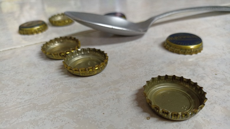 spoon and bottle caps