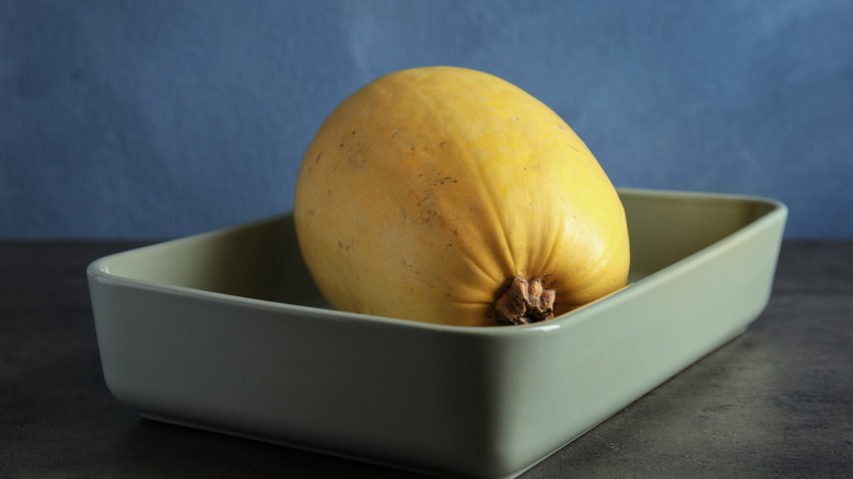 Squash in a grey baking pan on a counter