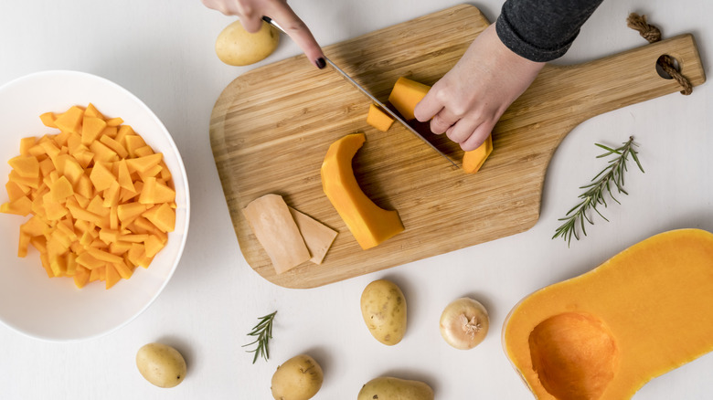 Halved squash on an orange background