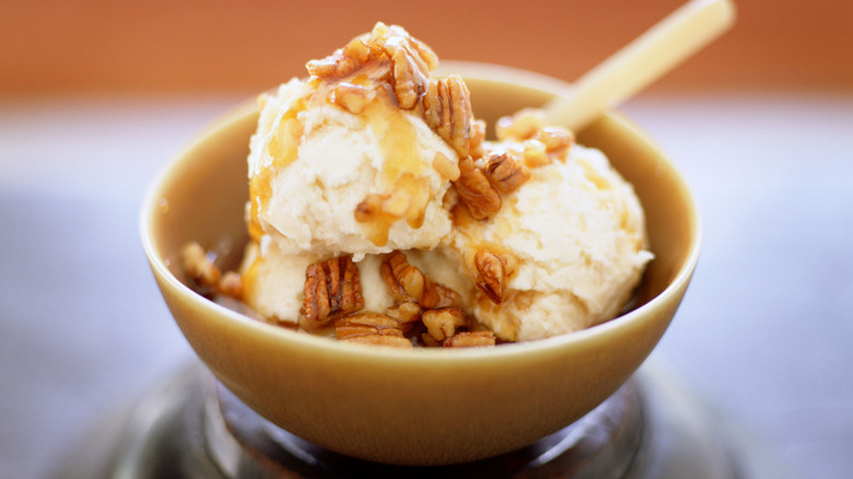 Vanilla ice cream topped with pecans