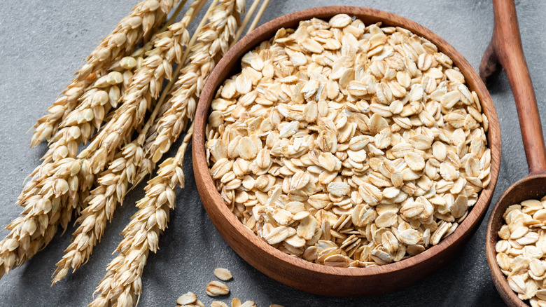 Rolled oats in wooden bowl