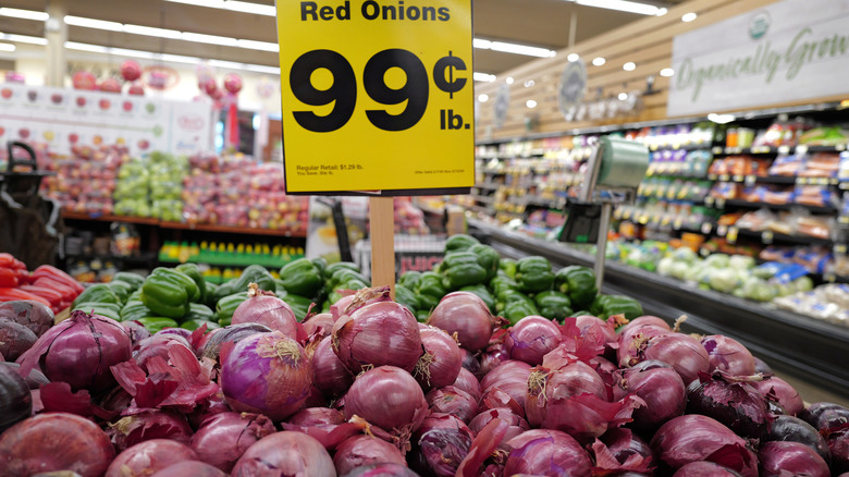 red onions for sale in a supermarket