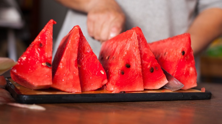 Slicing watermelon with seeds 