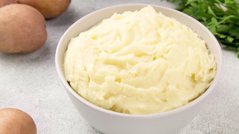 Plain mashed potatoes in a white bowl