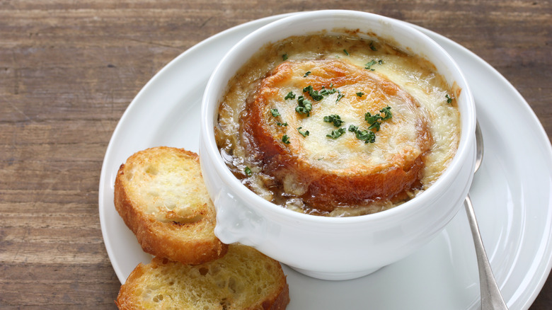 French onion soup in a white dish.