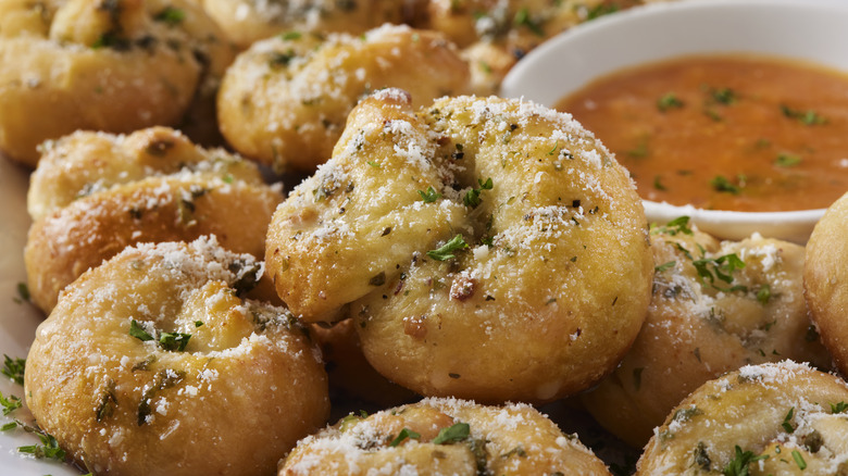 garlic knots with a marinara dipping sauce