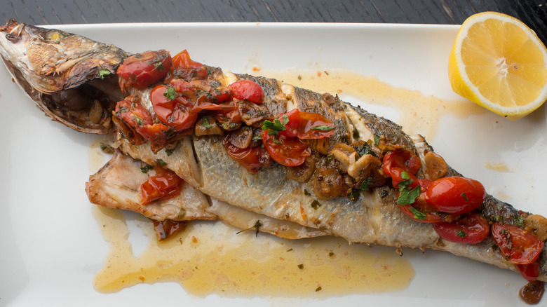 Plate of grilled branzino and vegetables