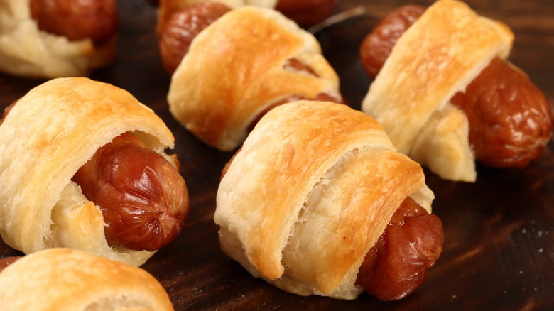 baked pigs in a blanket with golden pastry