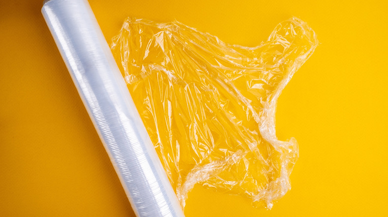 Cling film against a yellow background