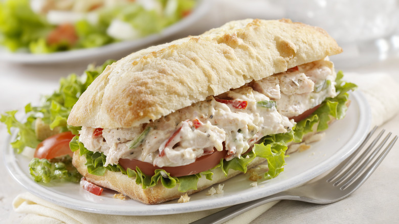 A chicken salad sandwich on a fresh white sub