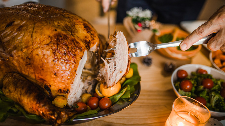 Man carving a turkey