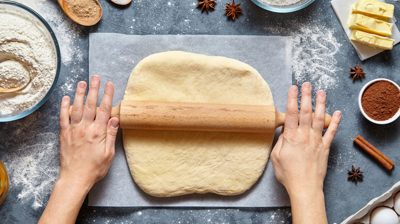 Baker rolling pie dough