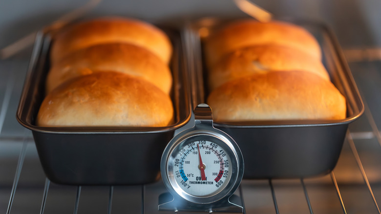 Golden-brown bread baking in an oven.