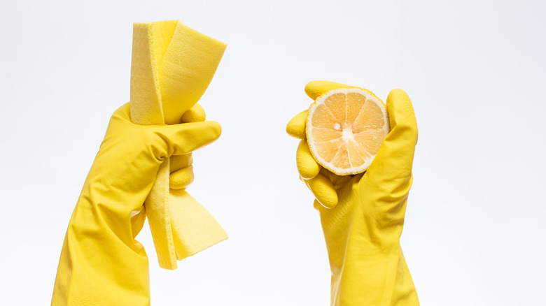 yellow gloves with lemon for cleaning