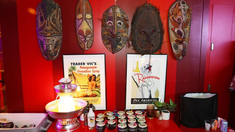 Tdarer Vic's-inspired display with posters, tiki masks, and drinks