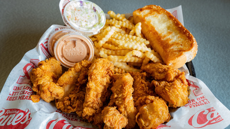 A basket full of Raising Cane's menu items.